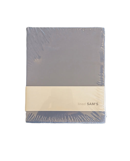 Blue fabric with a beige band labeled 'Sams' Notebook on a white background