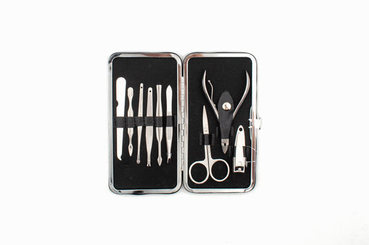 Manicure set with tools in a black case on a white background