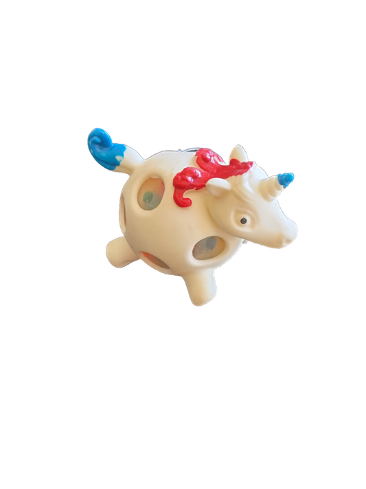 Toy unicorn with a red hair on a white background