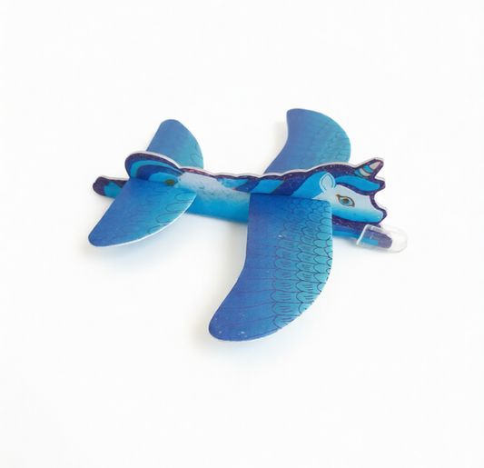 Blue toy airplane with a cartoon face on a white background