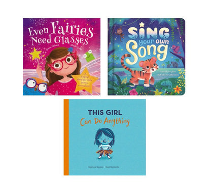 Three children's books arranged on a white background: 'Even Fairies Need Glasses' with a pink/purple cover, 'Sing Your Own Song' with a blue/turquoise cover and orange tiger illustration, and 'This Girl Can Do Anything' with a light blue cover and orange spine.