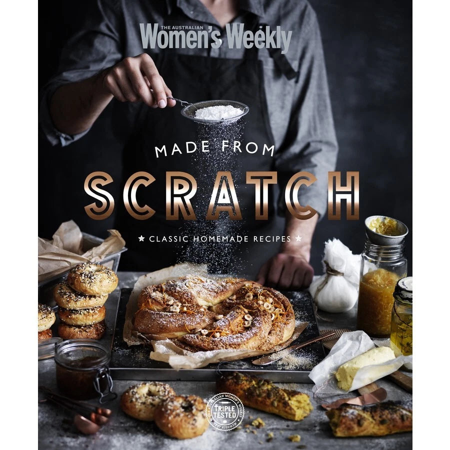 Cookbook cover of 'Made from Scratch' with a person sprinkling flour over baked goods.